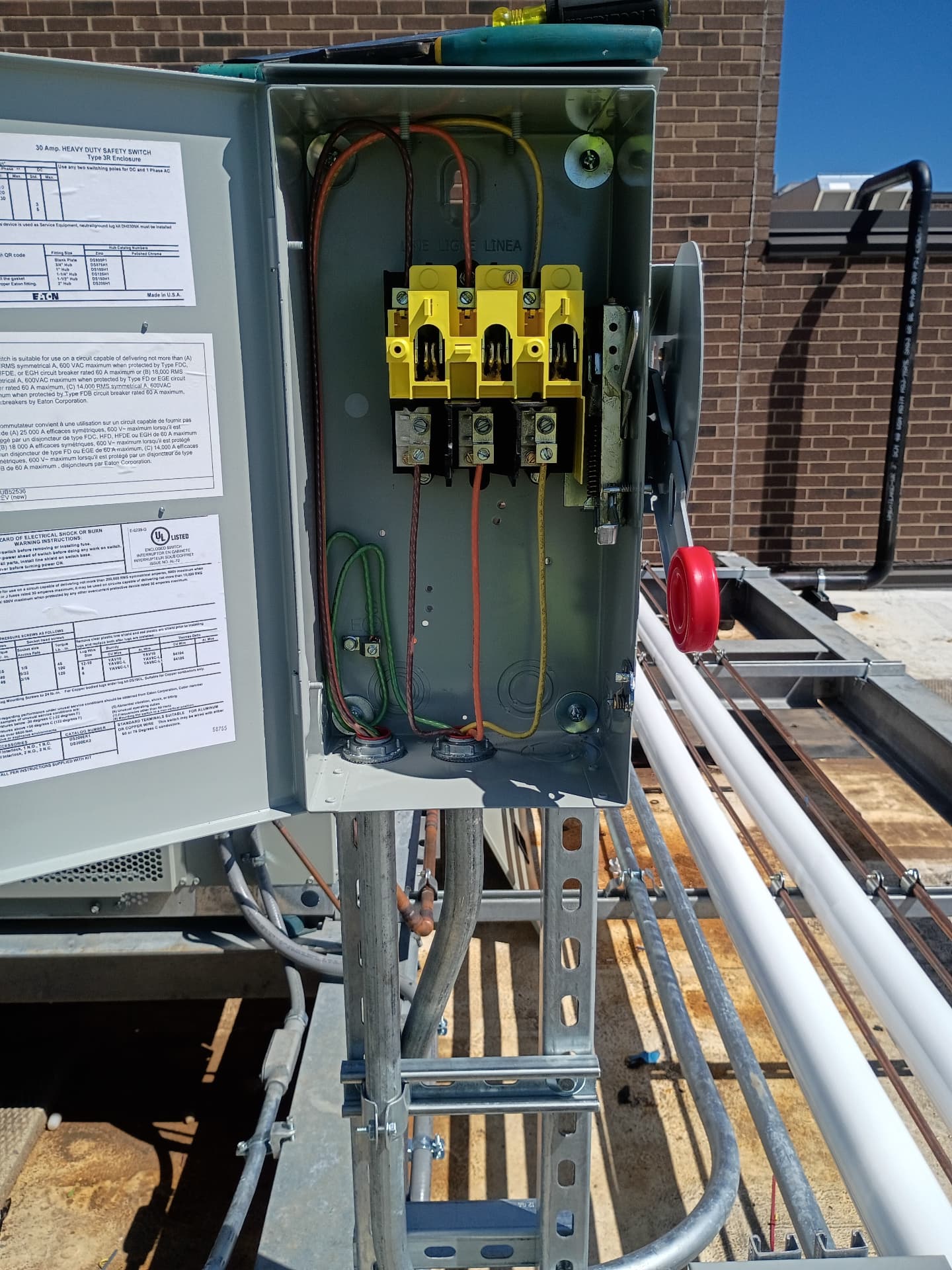 Eaton heavy-duty safety switch mounted on a rooftop near mechanical equipment